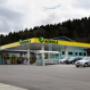 AGROLA Tankstelle in Elsau, mit TopShop, grosser Vorplatz, türkis-farbenes Gebäude hinter Tankstelle; rechts Autos geparkt