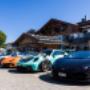 Luxury sports cars driving through the Bavarian countryside during a curated European driving tour.